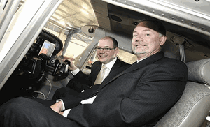 QUT researcher and ARCAA acting director Professor Duncan Campbell (right) and Queensland Treasurer Andrew Fraser in a Cessna at the launch of ARCAA. (QUT Erika Fish)